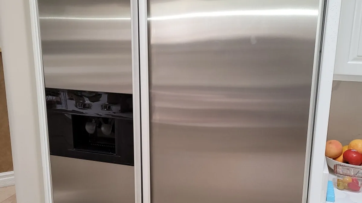 Factory-certified appliance repair technician servicing luxury refrigeration, laundry suites, and cooking ranges in South Holland, IL